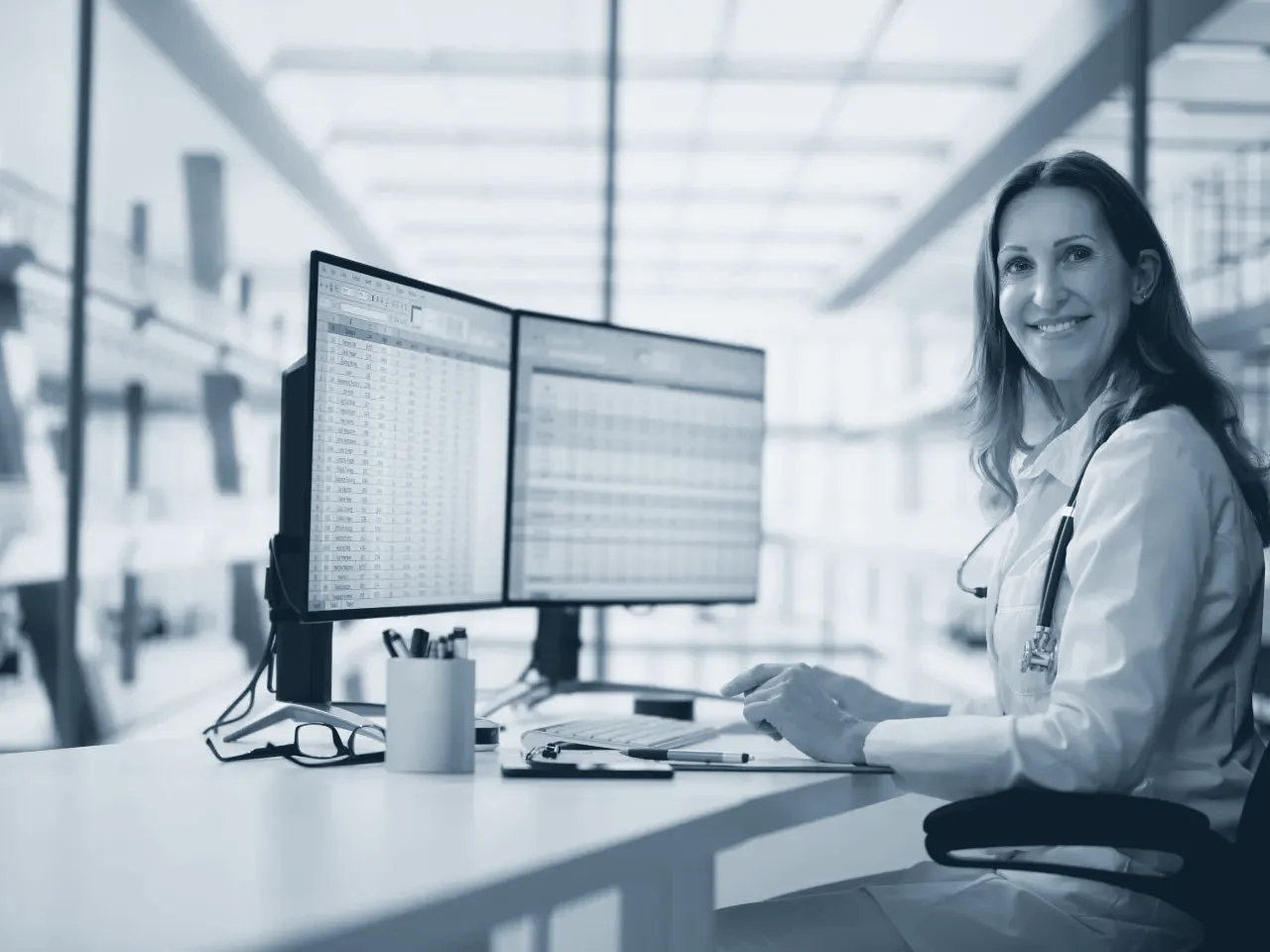 A clinician reviewing a cardiac study at a reporting workstation